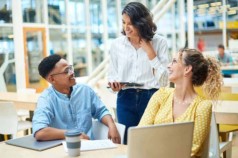 Office workers using laptops